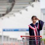Happy Asian girls in graduation gowns on their graduation day at school.Graduation concept with copy space.
